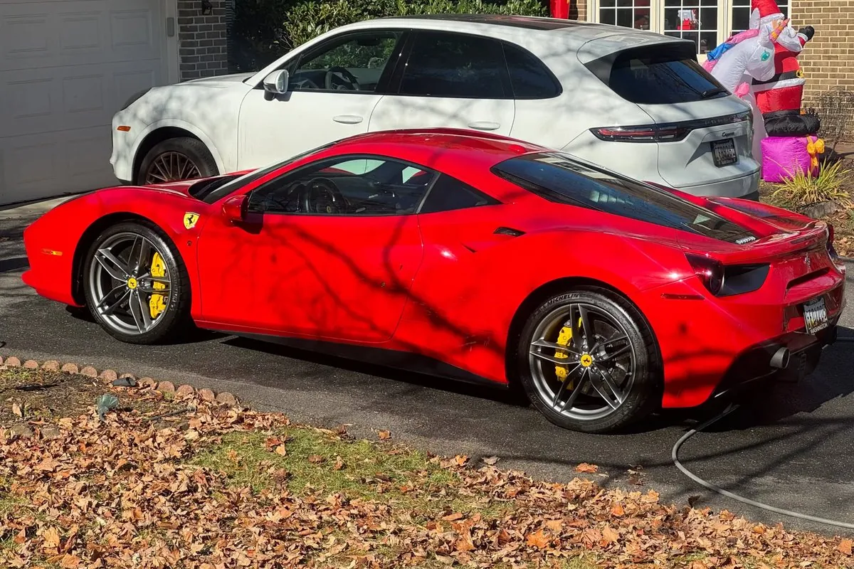 Detailed red Ferrari parked in a driveway